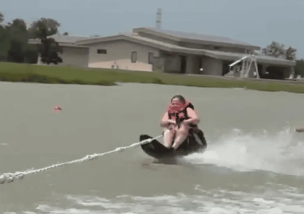A full-time wheelchair user, Kristy proves adventure has no limits—here she is adaptive water skiing and loving every moment.