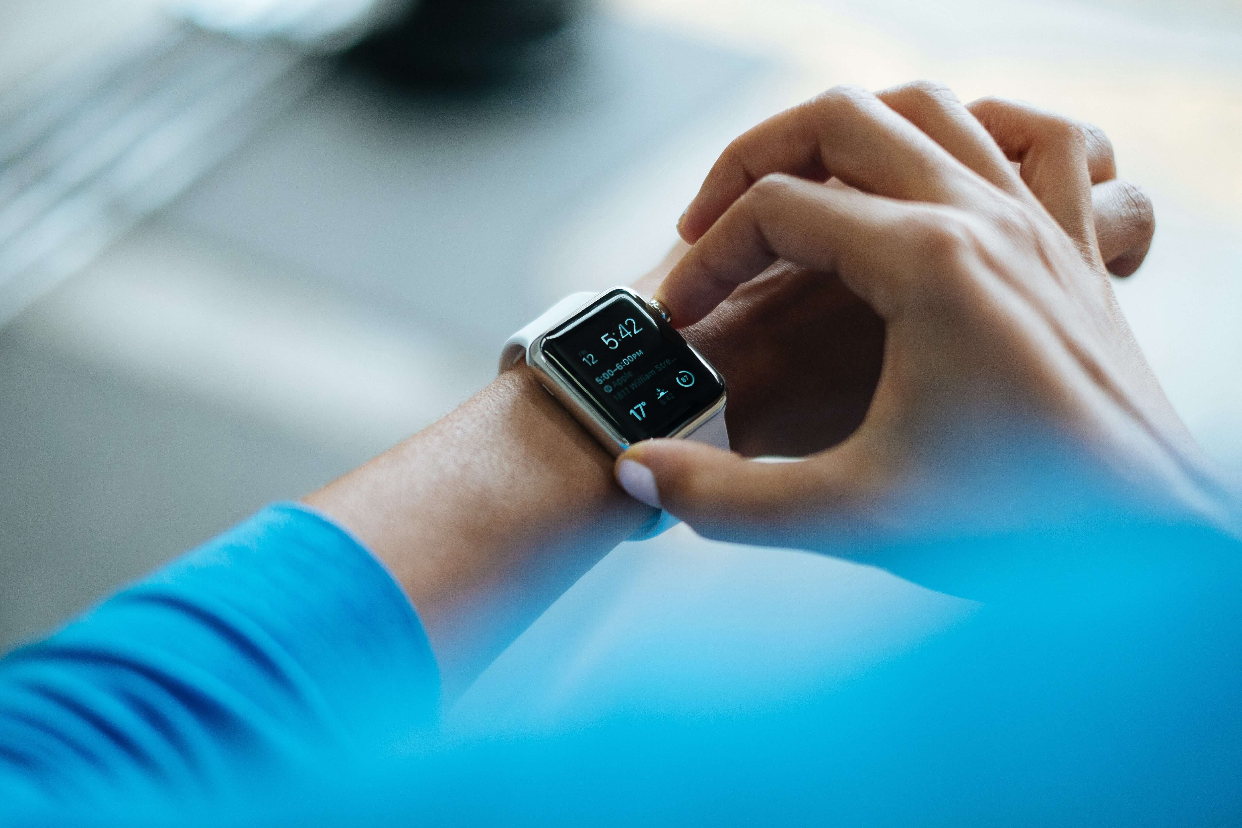 Woman checking smart watch