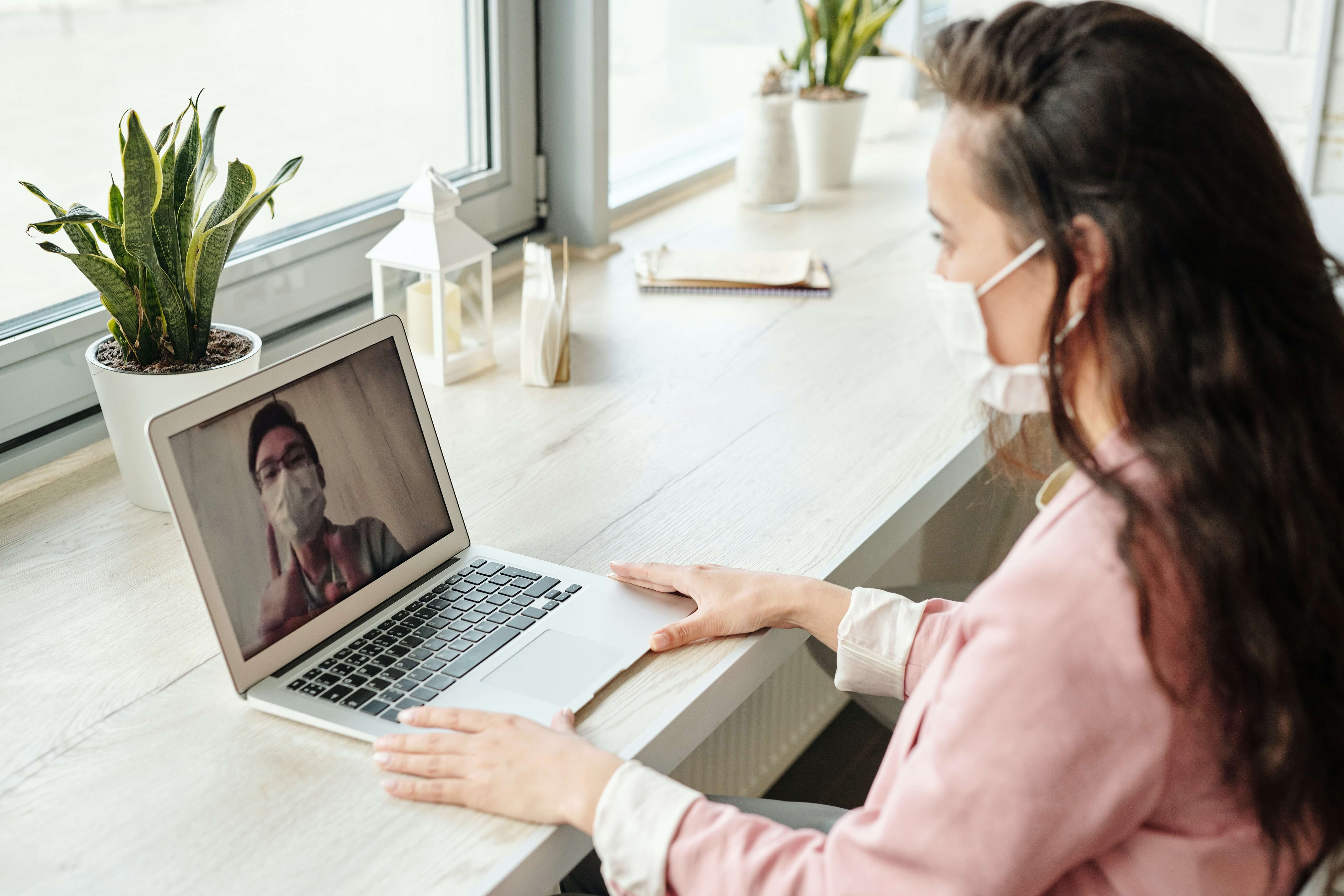 Woman consulting with doctor online